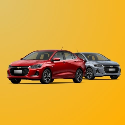 A imagem mostra dois chevrolet onix 2024, um na cor vermelha e outro na cor chumbo